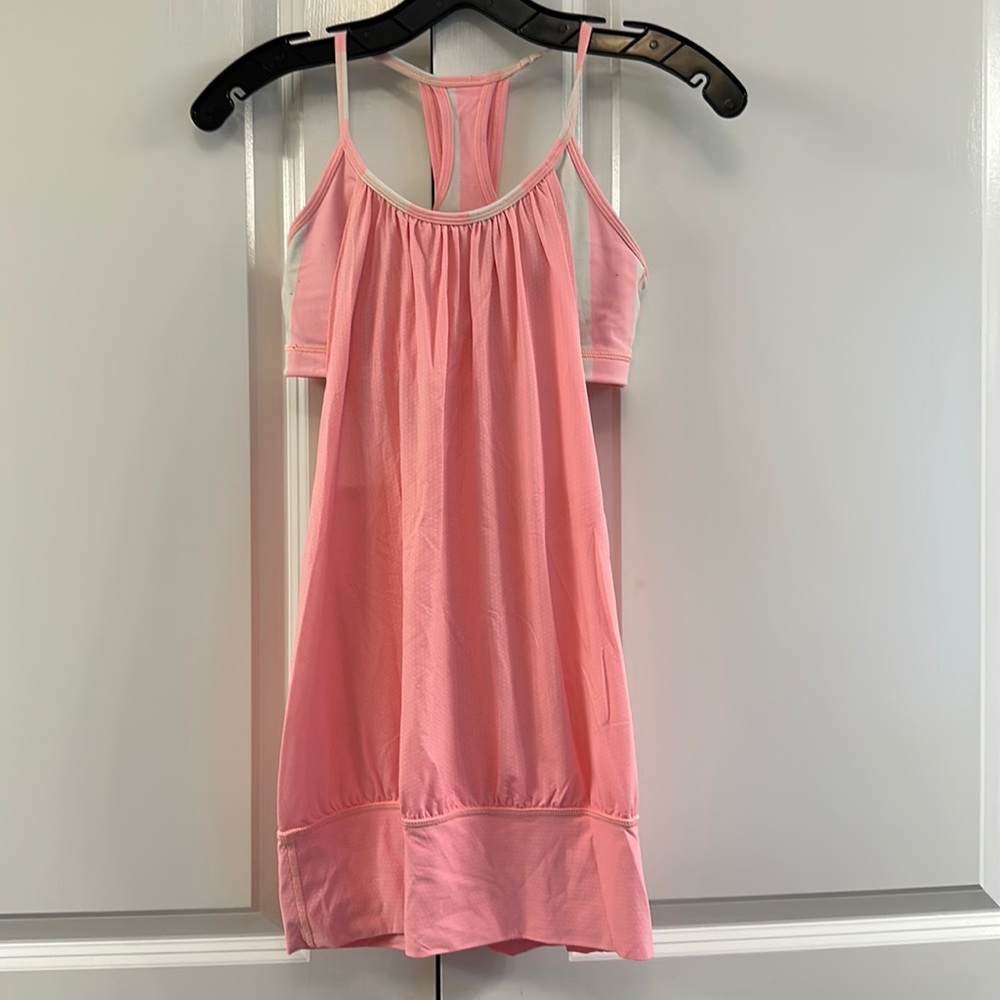 Lululemon loose fitting too with built in bra. Size 4. Peach/pink color